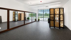 Bentonville apartment for rent - A room with a grey floor and a white wall with a window.