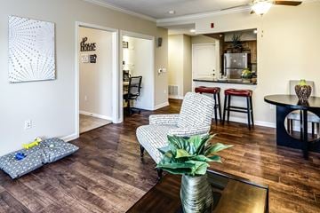 Omaha apartment for rent - a living room with a table and chairs and a kitchen