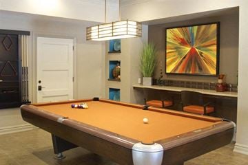 Omaha apartment for rent - a pool table in a living room with a painting