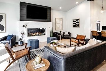 Omaha apartment for rent - a living room with a fireplace and a tv