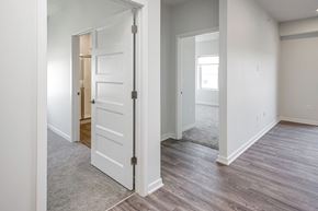 Omaha apartment for rent - One, two and three-bedroom floor plans featuring two interior design schemes, quartz countertops, tile backsplash, stainless steel appliances, backlit mirrors, high-end finishes and more at 148 Place Apartments in Omaha, NE