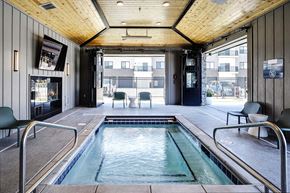Omaha apartment for rent - One, two and three-bedroom floor plans featuring two interior design schemes, quartz countertops, tile backsplash, stainless steel appliances, backlit mirrors, high-end finishes and more at 148 Place Apartments in Omaha, NE