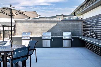 Outdoor lounge with fire pits and grilling stations