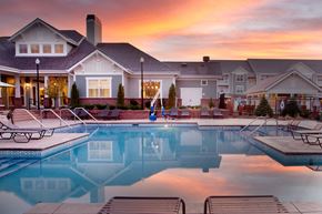 Lincoln apartment for rent - Resort-style pool with sundeck at Aventine Wilderness Hills in Lincoln, NE