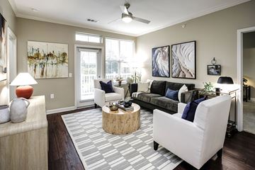 Lincoln apartment for rent - A living room with a white couch and a wooden coffee table.