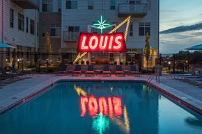 Omaha apartment for rent - A pool with the word Louis spelled out in the water.