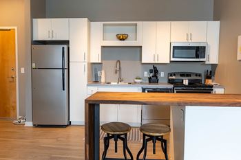 Chef-inspired kitchens with white or java cabinets