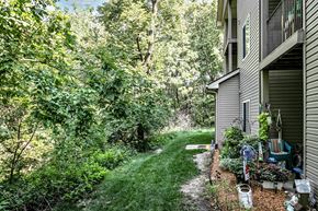 Council Bluffs apartment for rent - Back Patio with lush greenery at Deer Park Apartments in Council Bluffs, IA