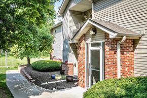 Council Bluffs apartment for rent - Cozy Exterior with Plants and greenery  at Deer Park Apartments in Council Bluffs, IA