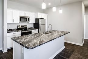 Fremont apartment for rent - Kitchen island at Deerfield Apartments and Chateaus in Fremont, NE