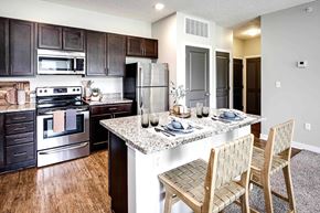 Lincoln apartment for rent - Luxury studio, one, and two bedroom apartment homes featuring granite countertops, stainless steel appliances, and fireplaces at East Lake Flats in Lincoln, NE