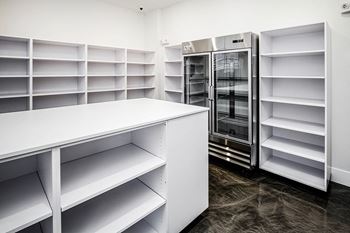 Package room and shelving with storage cooler