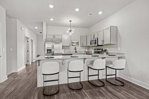 Bentonville apartment for rent - Three-bedroom townhomes featuring stainless steel appliances, premium LVT flooring, two car garage and much more at Hawthorne Row Townhomes in Bentonville, AR
