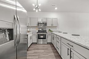 Bentonville apartment for rent - Three-bedroom townhomes featuring stainless steel appliances, premium LVT flooring, two car garage and much more at Hawthorne Row Townhomes in Bentonville, AR