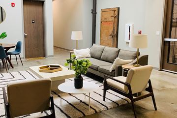 Omaha apartment for rent - a living room with a couch and chairs and a coffee table