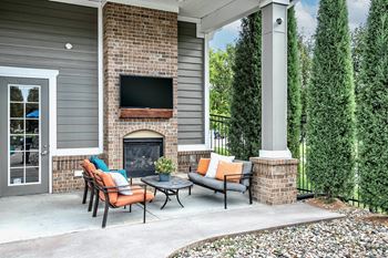 Poolside fireplace and seating area 