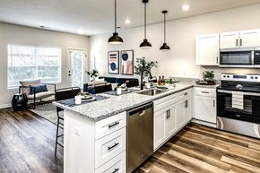 Papillion apartment for rent - Studio, one and two bedroom apartment homes featuring stainless steel appliances, luxury vinyl floor, granite countertops, large closets and full-size washer and dryer at The Parker in Papillion, NE