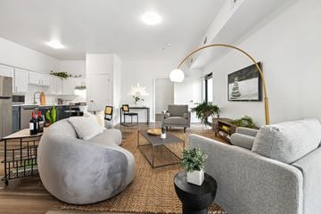 Bentonville apartment for rent - a living room with a couch and a chair and a table