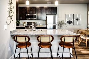 Ankeny apartment for rent - Kitchen with stunning countertops at Sterling Prairie Trail North in Ankeny, IA