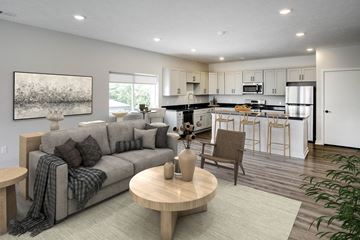 Plattsmouth apartment for rent - a living room and kitchen with a couch and a table
