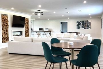 Bentonville apartment for rent - a living room and dining room with a couch and a table