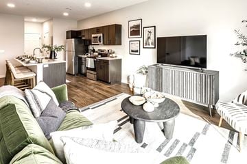 Omaha apartment for rent - a living room with a couch and a table