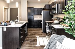 Omaha apartment for rent - Large kitchens with quarts countertops at The Westline at Flanagan Lake in Omaha, NE