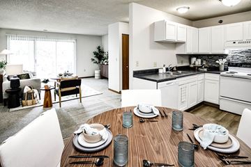 Lincoln apartment for rent - an open kitchen and living room with a wooden table