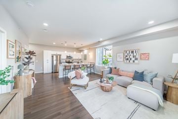 Joplin apartment for rent - A modern living room with a grey sofa and a wooden coffee table.