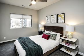Bellevue apartment for rent - VUE 19 (Model 2Bd) - Bedroom with a bed, nightstand, and a window.