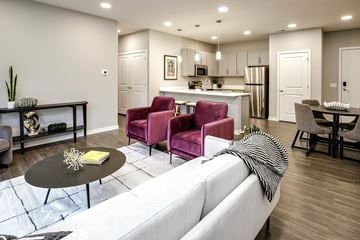 Bellevue apartment for rent - A modern living room with a white sofa and a black coffee table.