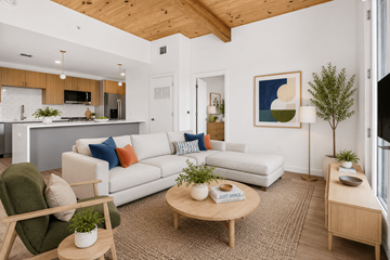 Springdale apartment for rent - A living room with a white couch and a wooden coffee table.