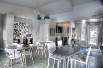 Omaha apartment for rent - a living room and dining room with a table and chairs