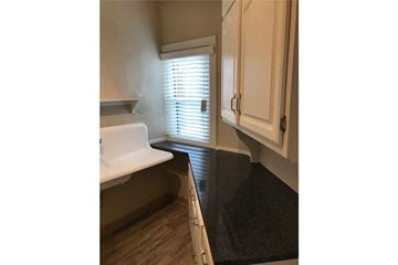 Omaha apartment for rent - a small kitchen with a sink and a window