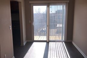 Bellevue apartment for rent - an empty living room with doors to a balcony