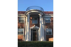 Omaha apartment for rent - the front of a building with columns and a balcony