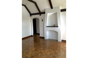 Omaha apartment for rent - a living room with a fireplace and wooden floors