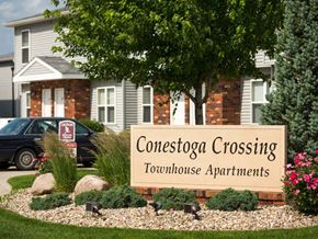 Fremont townhouse for rent - a sign for concession crossing townhouse apartments in front of a house