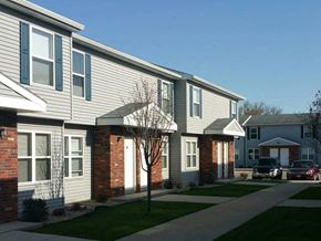 Fremont townhouse for rent - a row of houses with cars parked in front of them