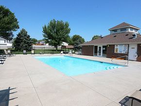 Lincoln townhouse for rent - a swimming pool with a house in the background