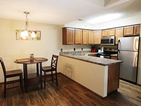Lincoln townhouse for rent - full kitchen with stainless steel appliances and a small table
