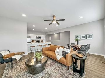 Waukee townhouse for rent - A living room with a brown couch and a coffee table.