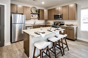 Lincoln apartment for rent - A kitchen with a table and chairs in front of it.