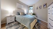 Easton apartment for rent - A bedroom with a bed, nightstand, and a rug.