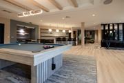 Easton apartment for rent - A pool table is in the middle of a room with a wooden floor.