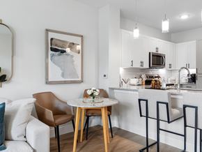 Wesley Chapel apartment for rent - A modern kitchen with a dining table and chairs.