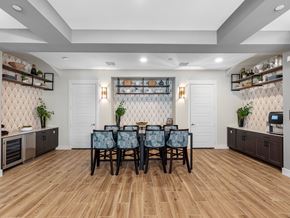 Wesley Chapel apartment for rent - A dining room with a wooden table and chairs.