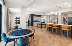 Austin apartment for rent - A modern dining room with a blue table and chairs.