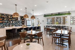 Glendale apartment for rent - clubhouse dining room with tables and chairs and a bar