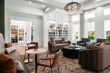 Glendale apartment for rent - A living room with a white table and brown chairs.